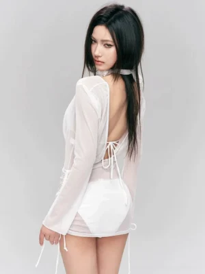 Back three-quarter view of white sheer mesh bikini dress set with open lace-up back and ruched drawstring hem