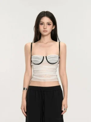 White sheer striped bustier crop top with black piping and slim spaghetti straps front studio view