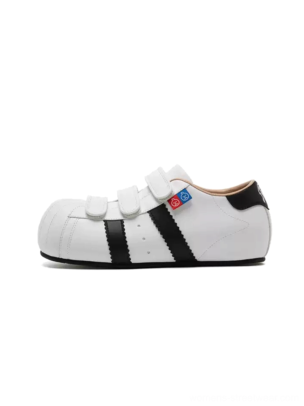 White shell toe strap sneakers with black side stripes and concealed 3 cm hidden lift on a plain background