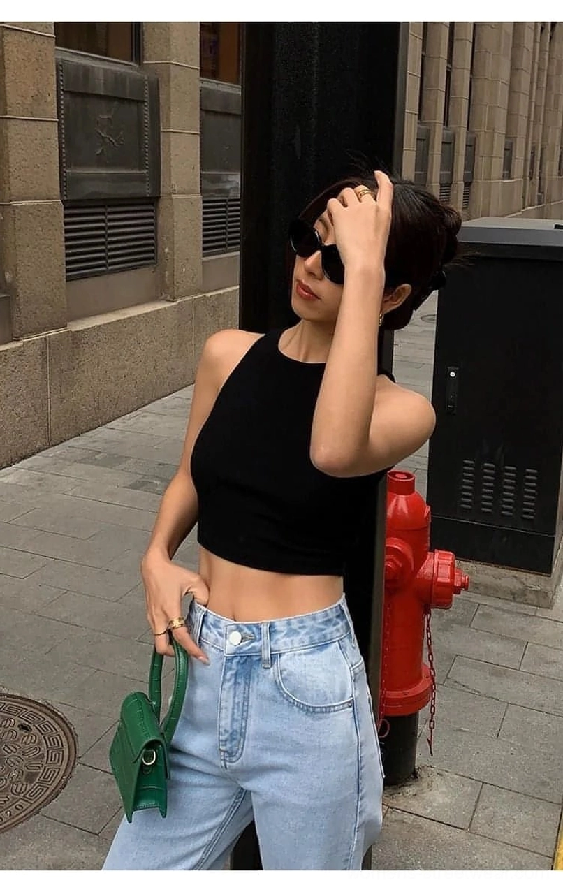 White sleeveless cropped tank top - pure cotton spandex blend with ribbed knit texture ideal for layering under oversized jackets blazers and mesh tops