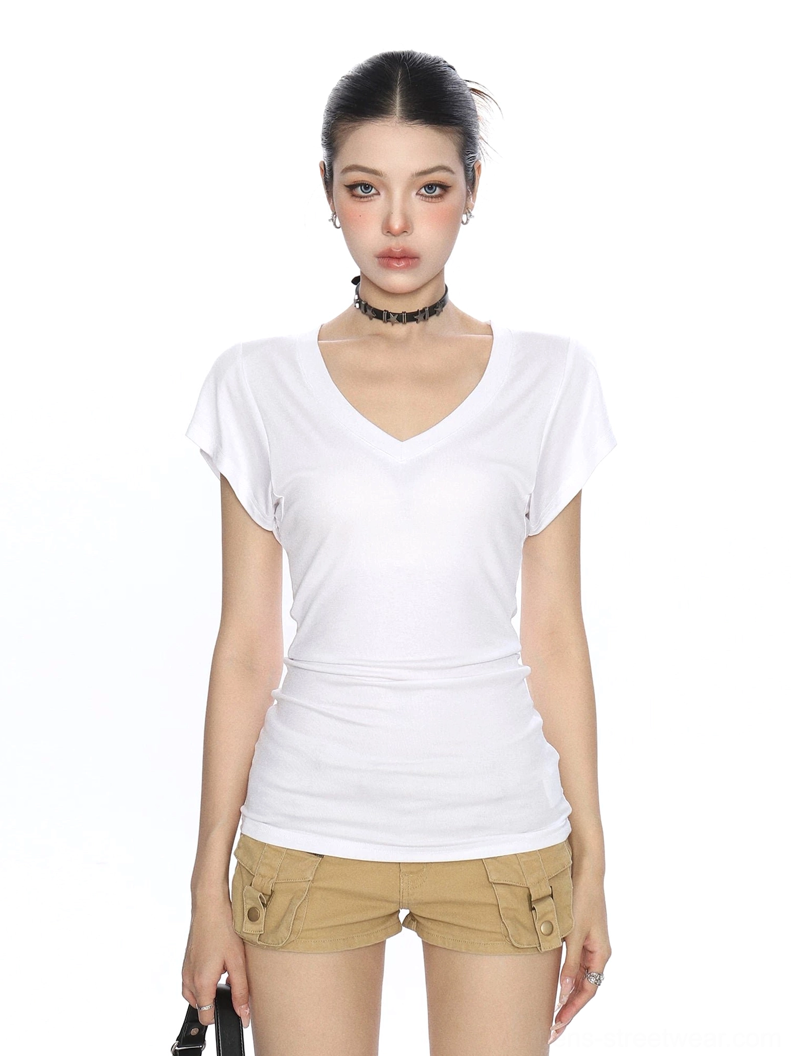 White slim V-neck ruched short-sleeve T-shirt styled with khaki cargo shorts in a Seoul-inspired women's streetwear outfit