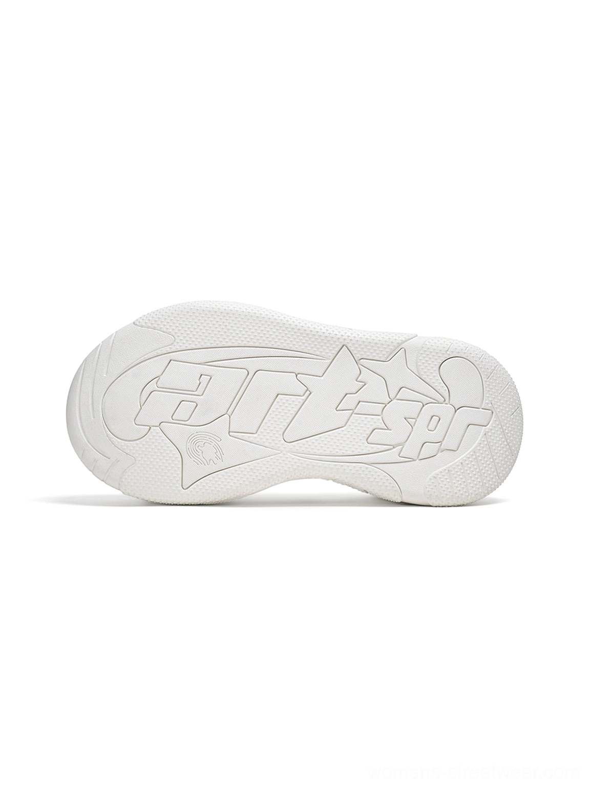 Close-up overhead view of the white sneaker rubber outsole with engraved lettering and textured platform tread