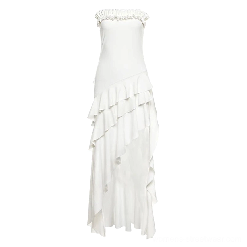 Product display of a pure white strapless ruffled maxi dress with asymmetric layered floor-length skirt and high side slit