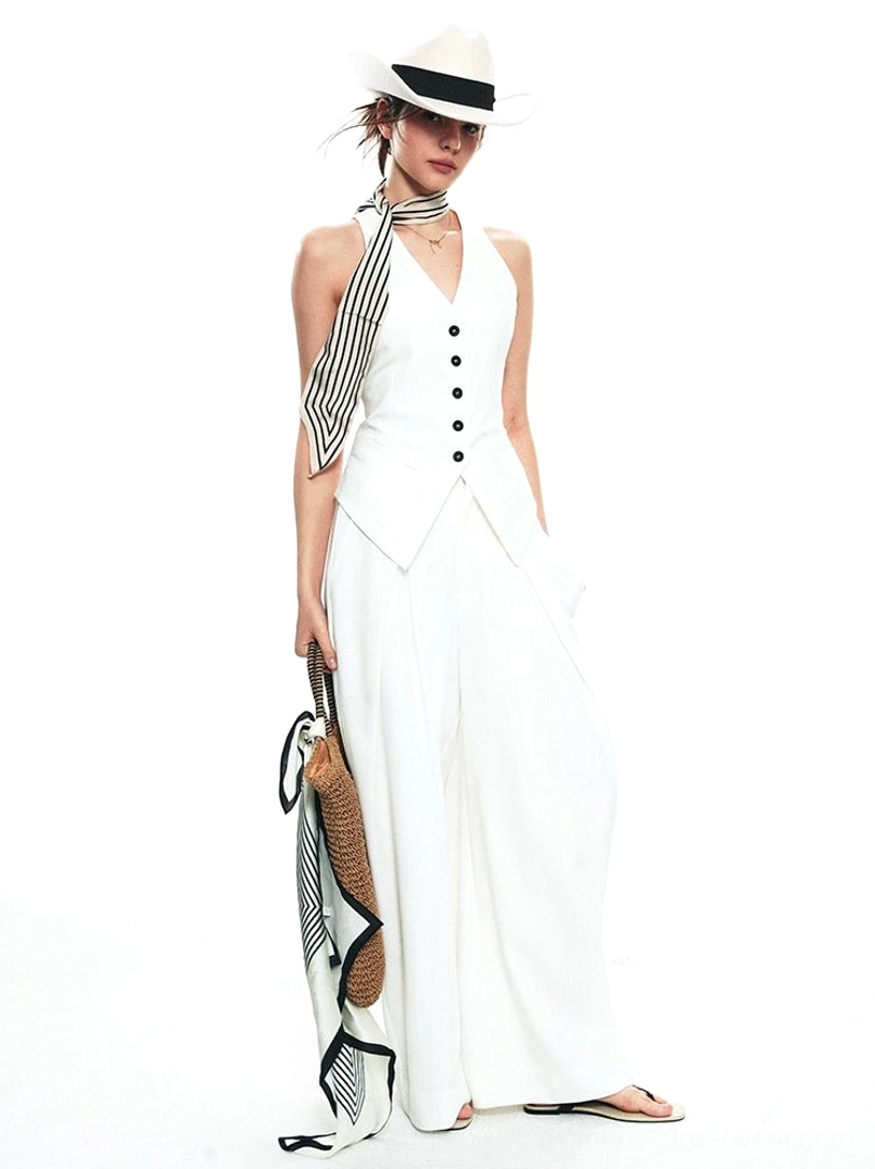 White tailored halter vest and wide-leg trousers streetwear set shown from the front side with fedora, striped scarf, and woven tote styling