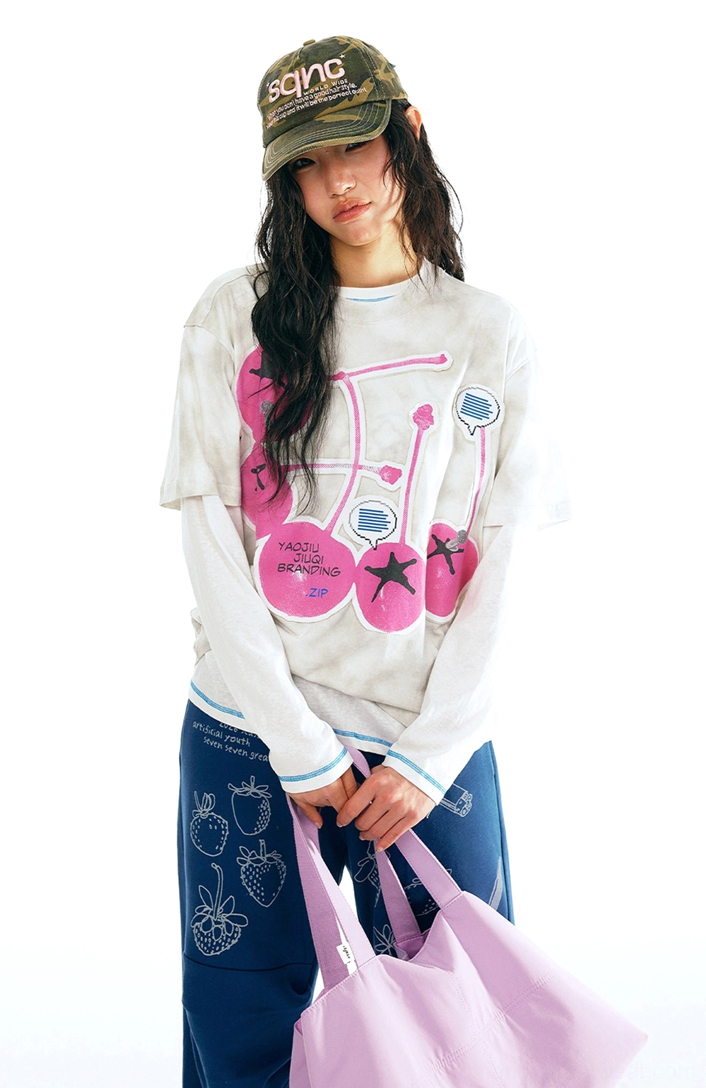 White tie-dye cherry graphic streetwear t-shirt front view with pink cherries star accents and layered styling inspiration
