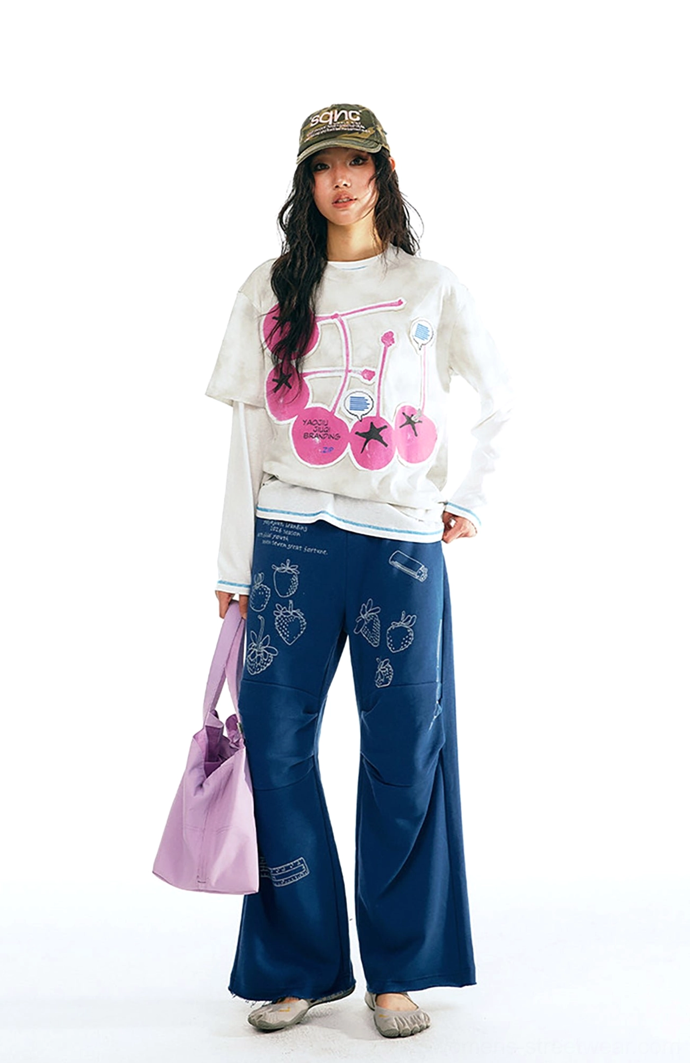 White tie-dye unisex cherry graphic cotton t-shirt with pink pop art print styled with navy wide leg pants