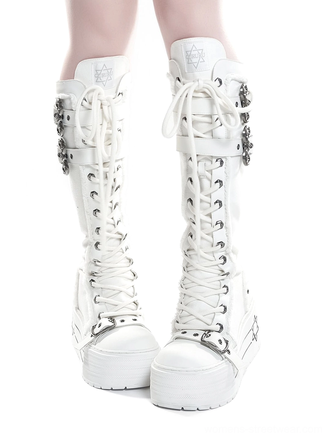 White lace-up knee-high platform combat boots pair displaying triple buckle hardware and chunky platform soles