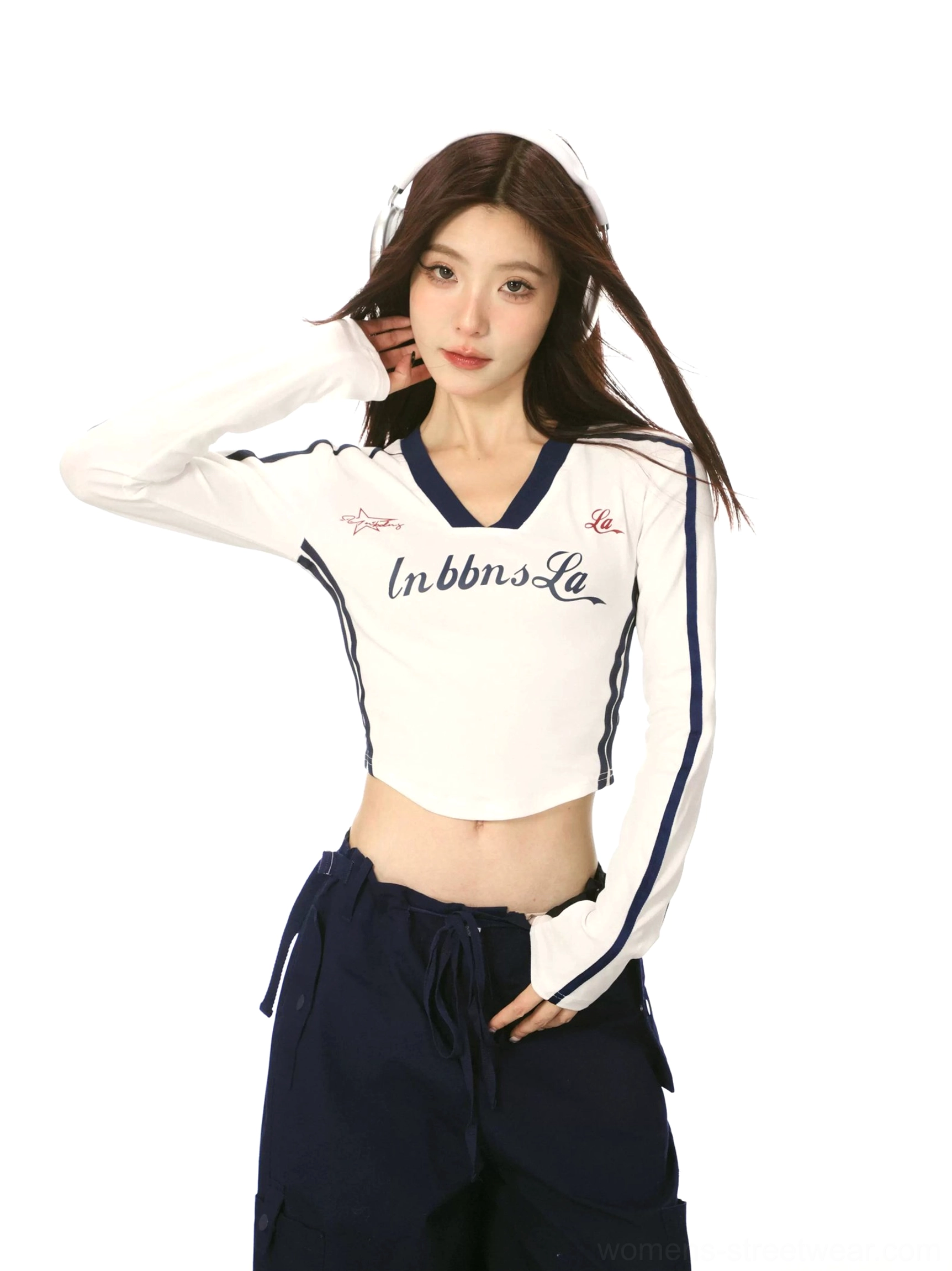 White women's V-neck cropped long sleeve streetwear top with navy color block trim, sleeve stripes, retro chest lettering, and sporty Korean fashion styling