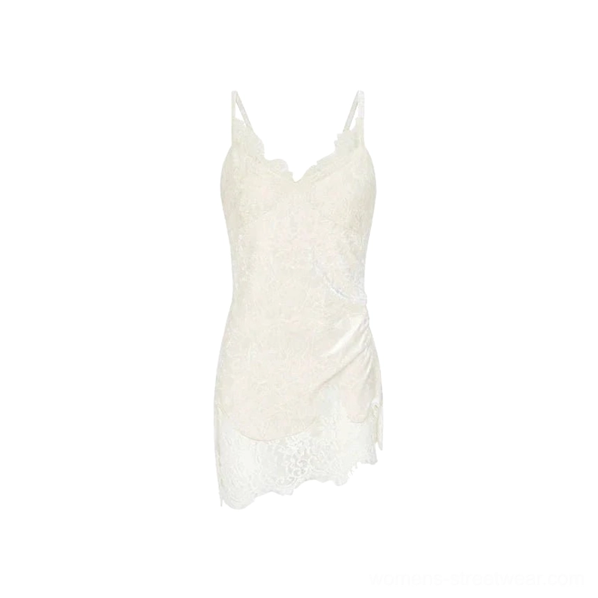 Flat lay product view of white velvet lace camisole with V-neck trim, lace paneled hem, and longline silhouette