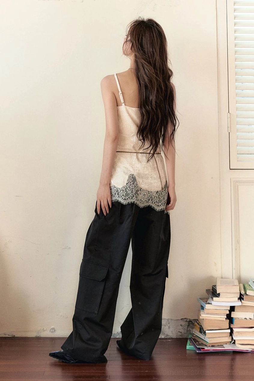 Back view of a white velvet lace camisole showing thin spaghetti straps, clean back design, and lace hem