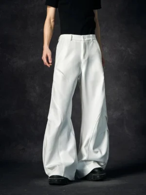 White wave contour wide-leg streetwear trousers shown from the front with sculptural curved seams, high-rise waistband, and exaggerated floor-length silhouette