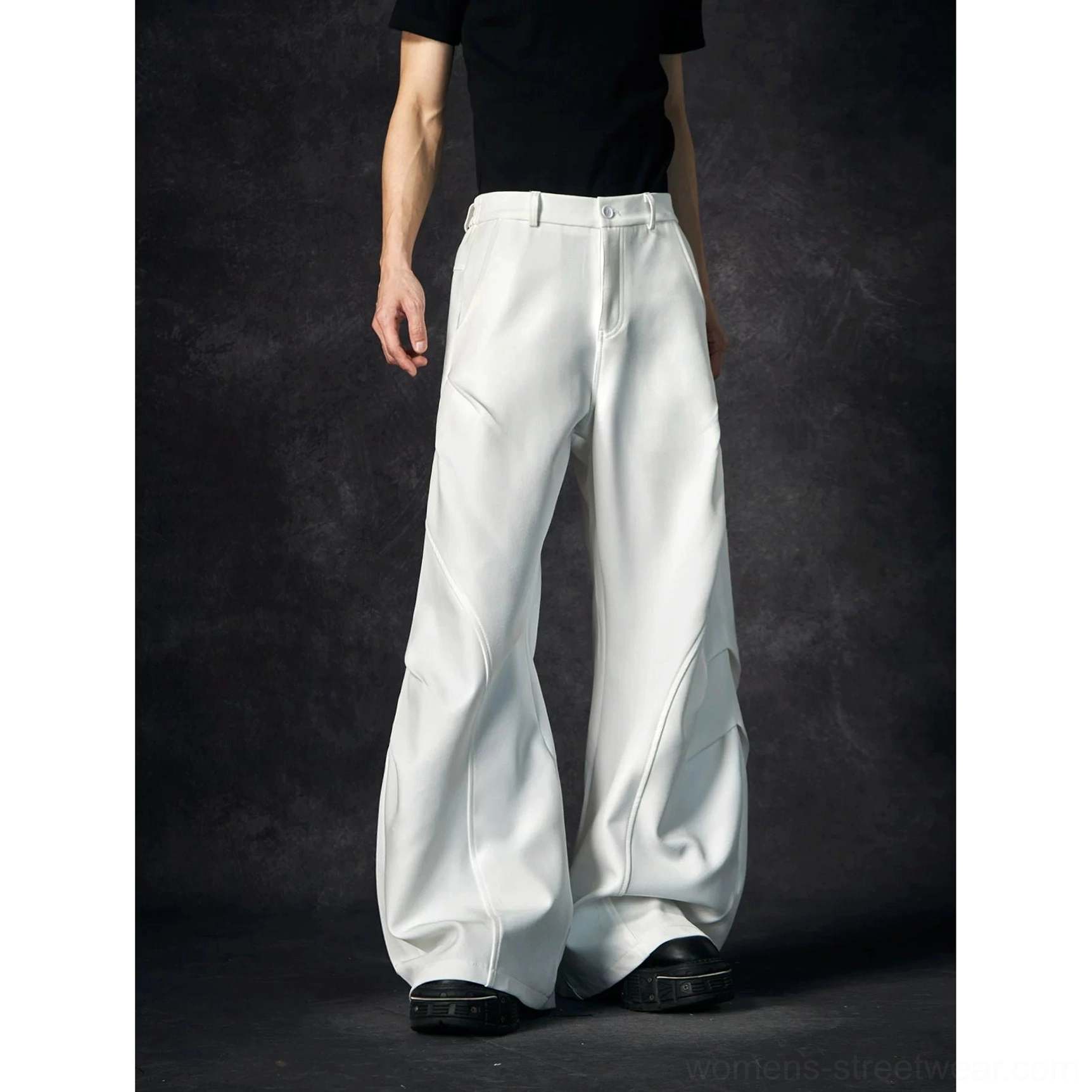 White wave contour wide-leg trousers product image showing the clean monochrome finish and exaggerated architectural shape