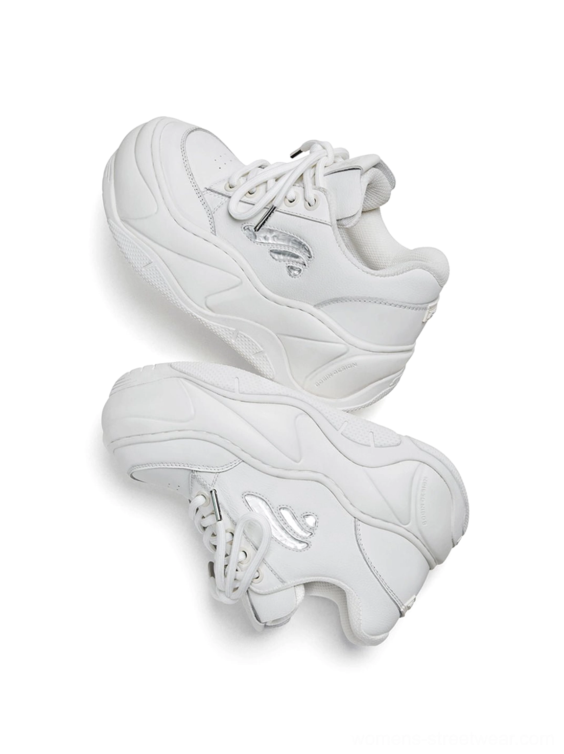White wave leather platform sneakers styled as chunky Y2K streetwear shoes with an all-white fashion-forward design