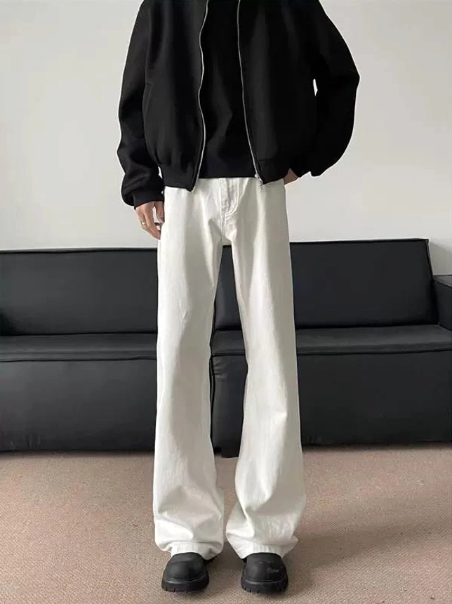 Front full-body view of clean white wide-leg flared denim jeans with a long stacked streetwear silhouette