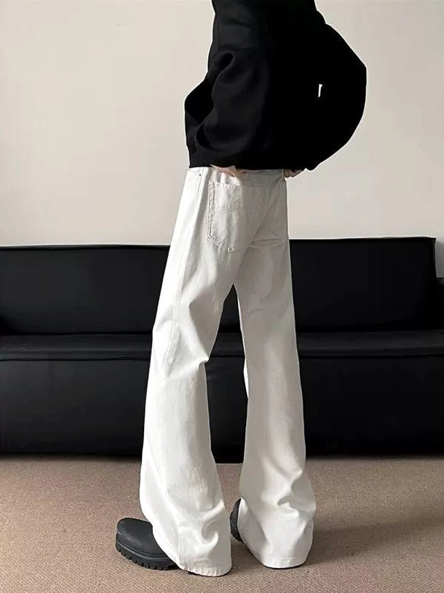 Rear right side view showing the back pocket and flared silhouette of white wide-leg streetwear denim jeans