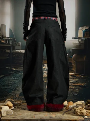 Back view of wide-leg black streetwear cargo pants with red tartan waistband dark red faux-fur cuffs and cargo pockets