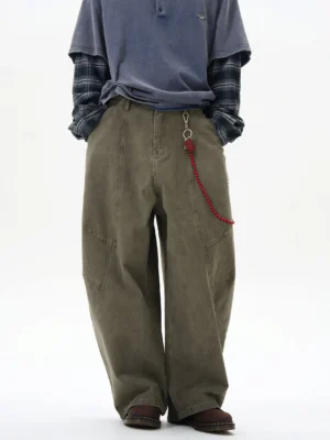 Olive green wide-leg cargo pants with red beaded chain detail shown in a front full-body streetwear studio look