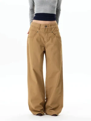 Front view of khaki wide-leg chino streetwear pants with high-waisted fit, relaxed drape, classic pockets, and full-length cotton twill legs