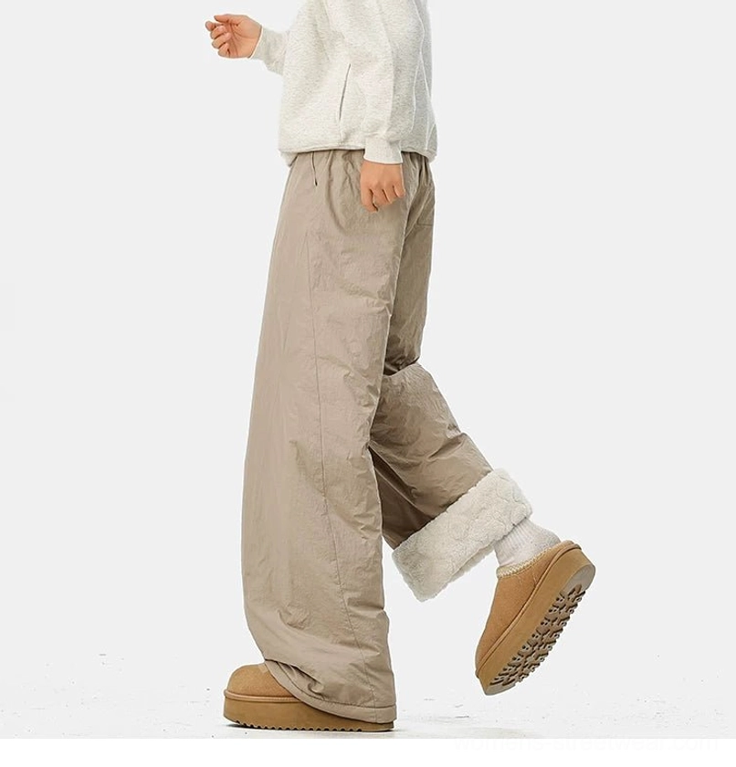 Wide-leg fleece-lined streetwear pants designed for layering with thermal leggings and chunky winter footwear