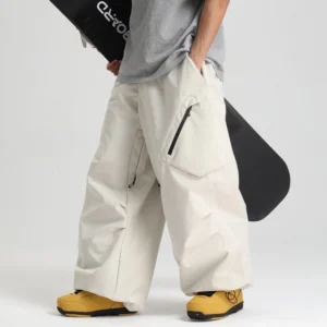 Wide-leg snow pants off-white color low side view male model gray tee yellow boots snowboard oversized cargo fit