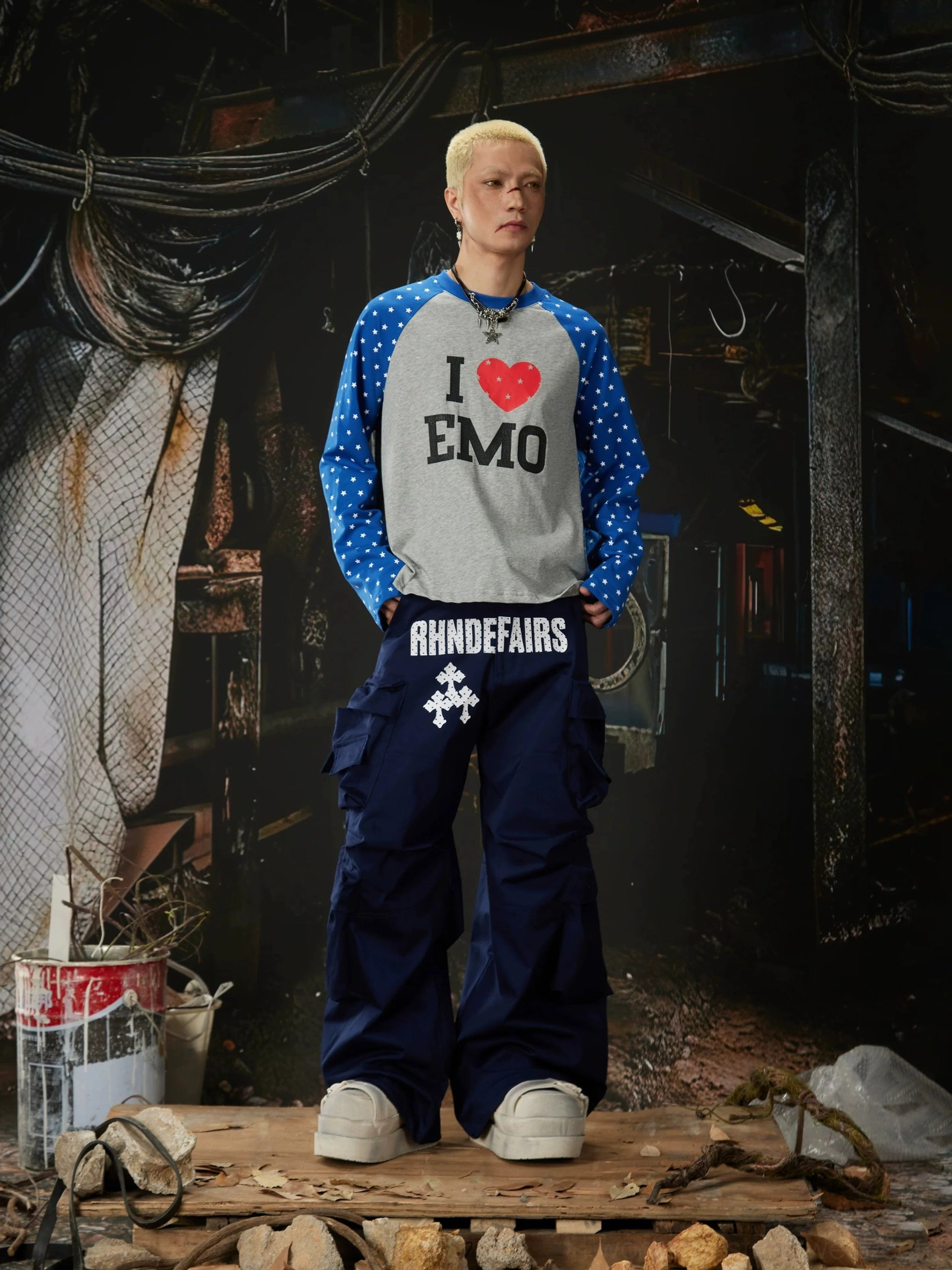 Wide-leg streetwear cargo pants close-up showing multi-pocket utility styling and cotton-rich fabric texture