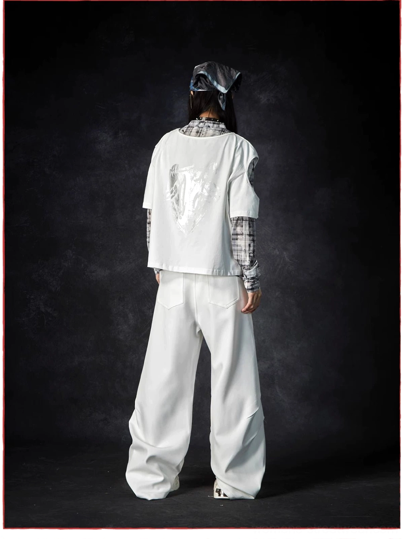 Wide-leg streetwear trousers product image showcasing the clean waistband, flowing drape, and modern avant-garde styling