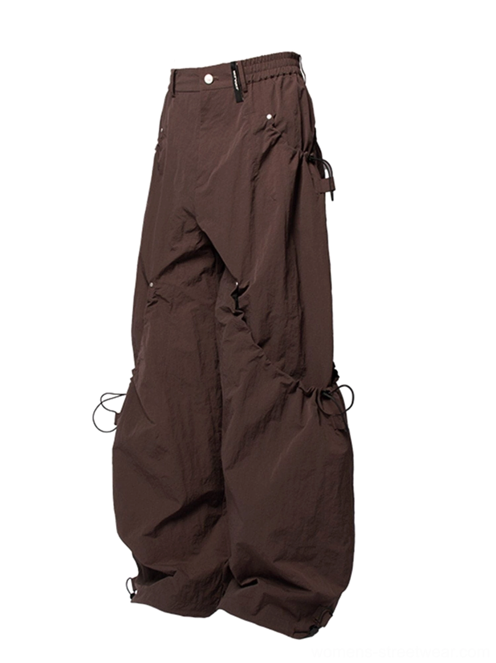 Dark brown wide leg technical cargo pants with drawstring waist cargo pockets and adjustable ankle cuffs shown from the front three quarter view