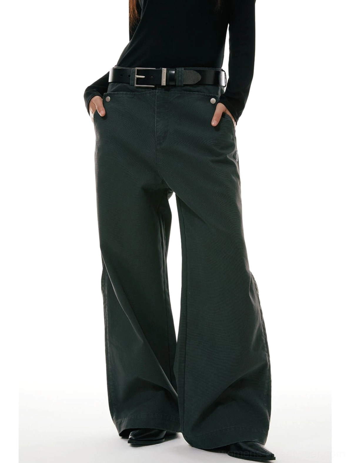 Dark olive green wide-leg workwear denim jeans worn with a black turtleneck and leather belt in a low-angle front streetwear outfit view
