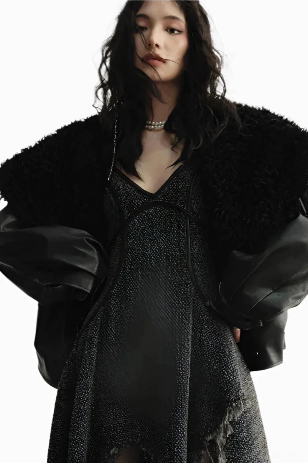 Close-up of the wide plush faux fur collar, distressed dark brown outer fabric, and tailored cuffs on an aviator jacket