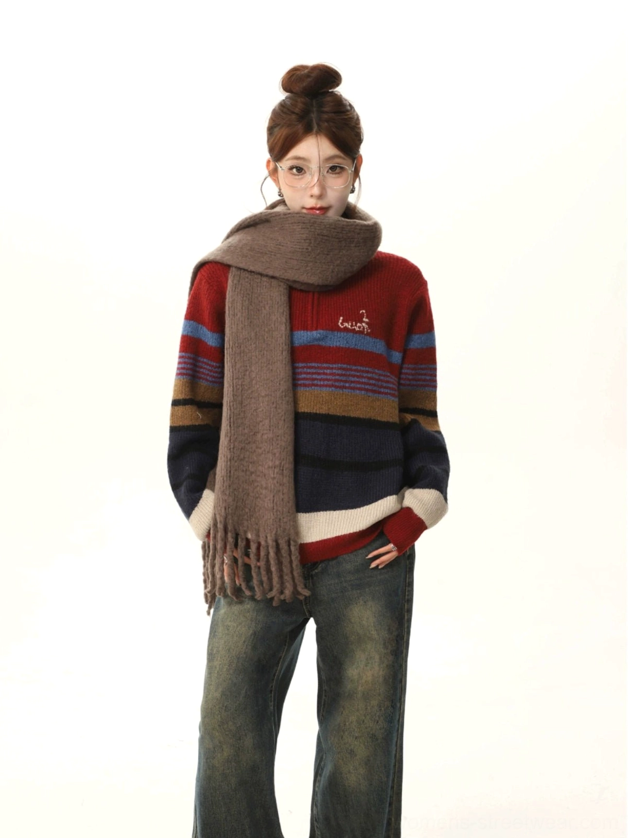 Wine red horizontal stripe knit sweater with embroidered chest detail styled with vintage wide-leg denim and tassel scarf
