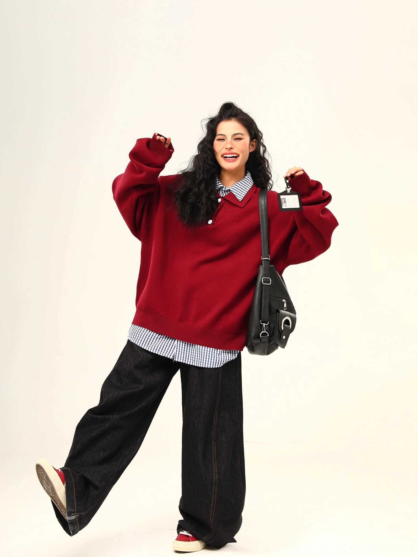 Wine red oversized polo sweater styled with a gingham shirt and wide black pants for a playful Korean streetwear outfit