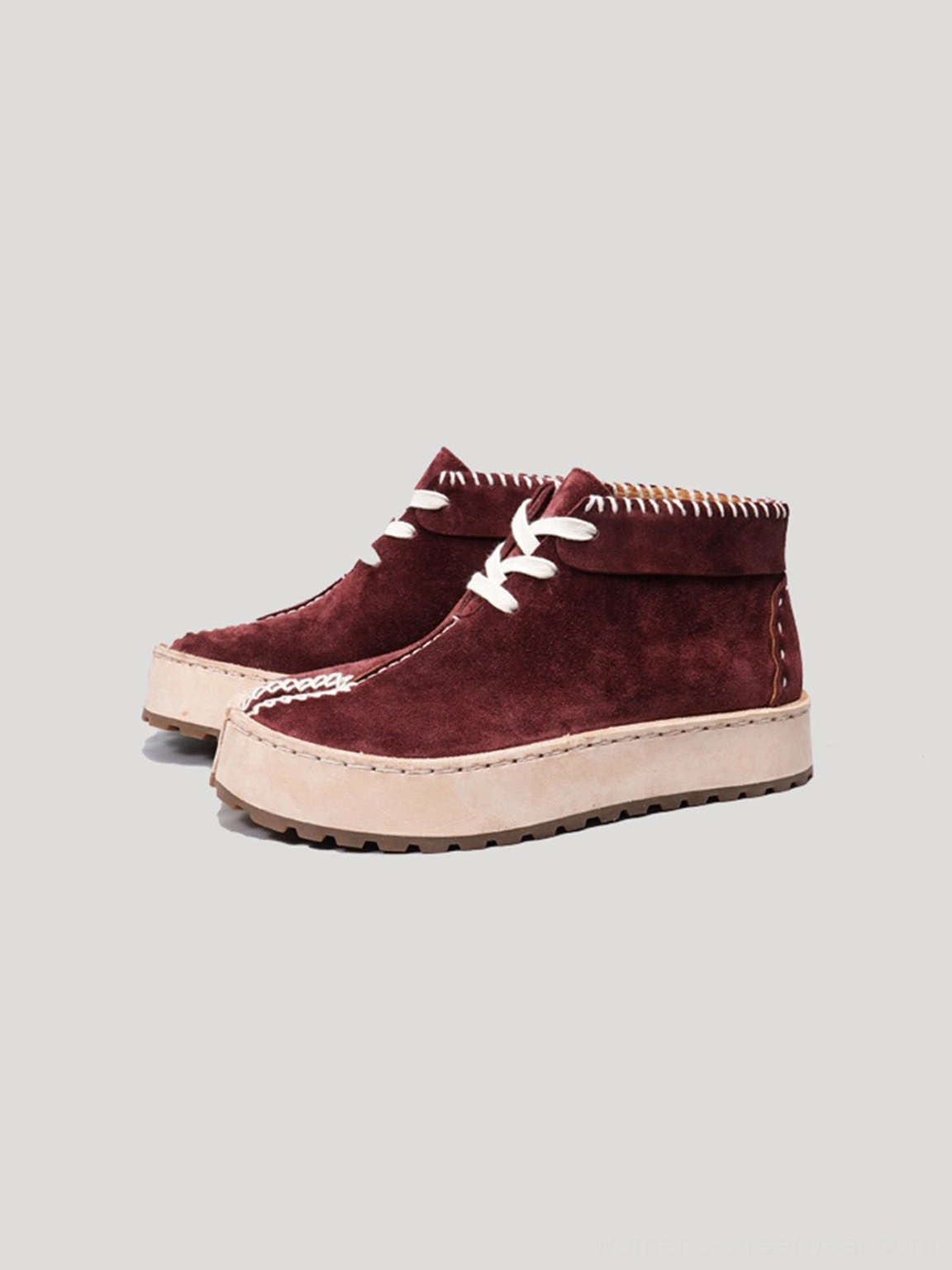 Wine red split-toe suede-finish leather lace-up chukka boots shown from the front with white contrast stitching and platform sole