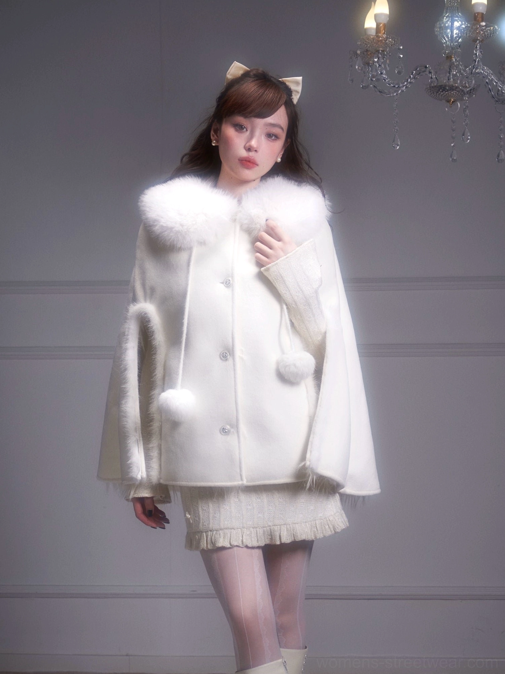 Winter white fur collar cape coat front full body view with pom-pom drawstring ties and button closure