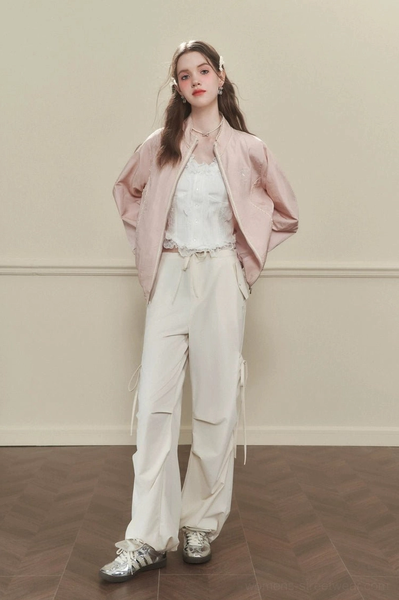 Women's apricot Korean streetwear side-tie wide-leg cargo pants styled with a white lace top and pink jacket