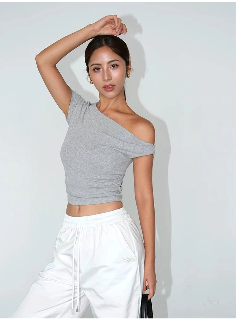Women’s asymmetric cropped tee in soft stretch knit with a close body-hugging silhouette