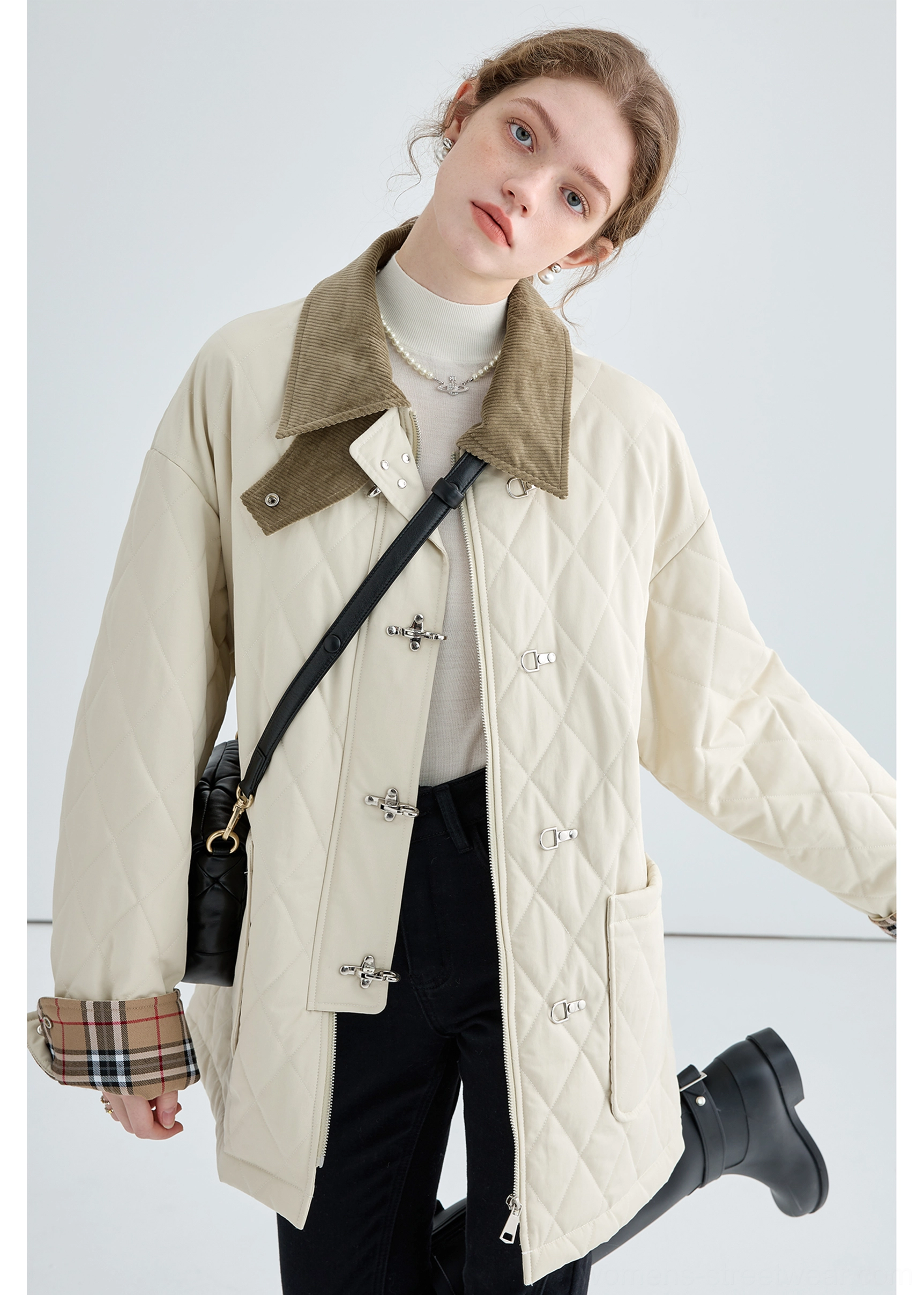 Diamond quilted cotton texture detail on women's beige long jacket with warm padded streetwear design