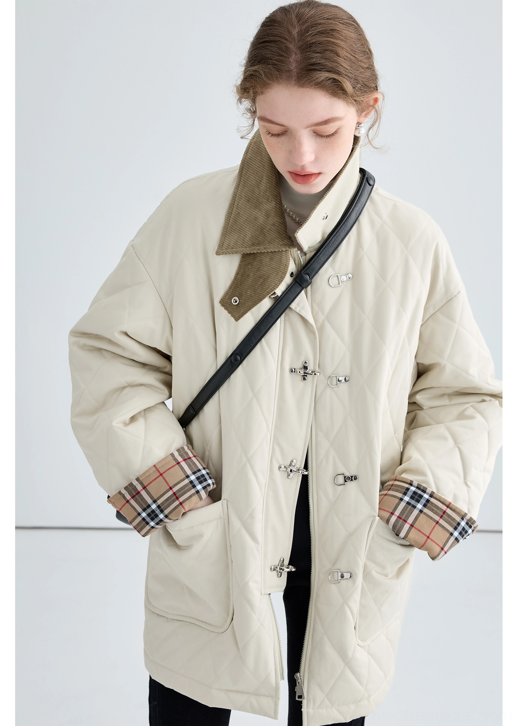 Women's beige quilted cotton jacket featuring a brown corduroy collar and vintage-inspired utility styling