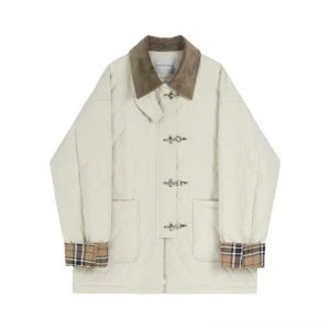 Front flat lay of women's beige diamond quilted cotton jacket with contrast corduroy collar, plaid turn-up cuffs, patch pockets and metal buckles