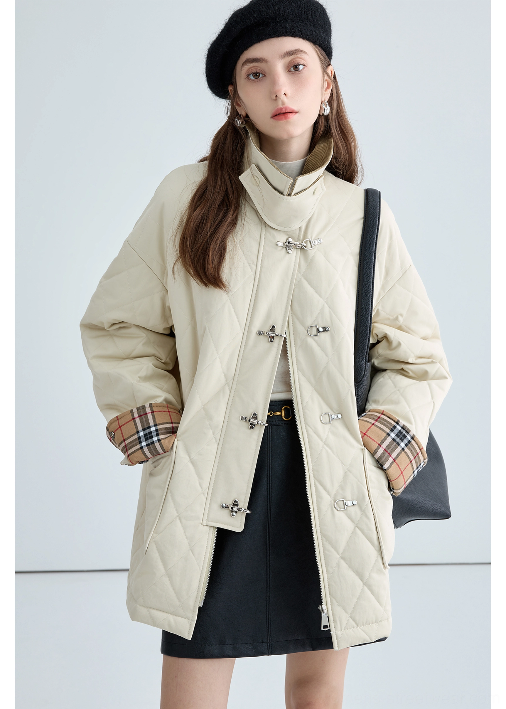 Front patch pocket detail of women's beige diamond quilted cotton jacket with contrast corduroy collar