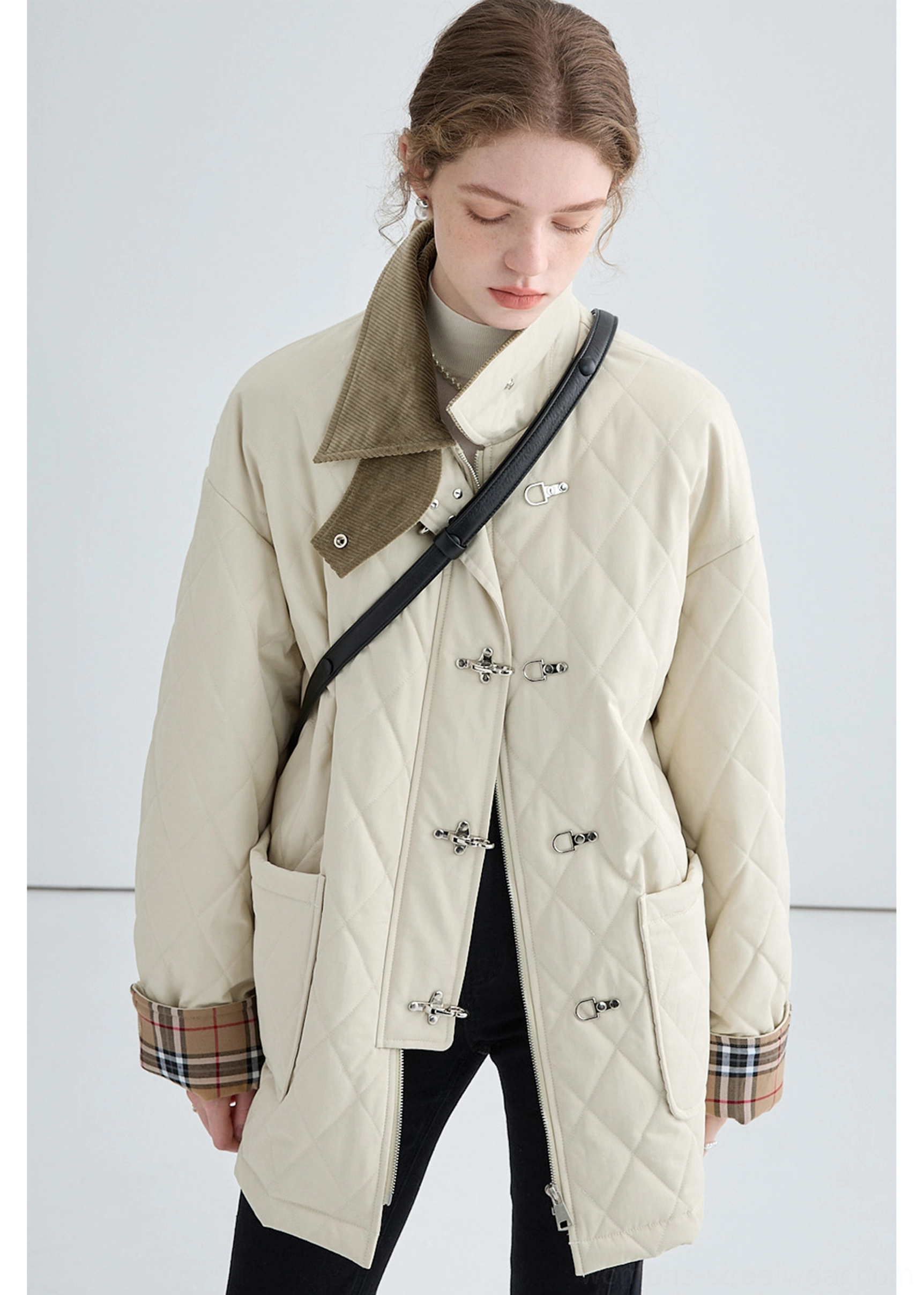 Women's contrast corduroy collar quilted cotton jacket in beige shown from the right side with metal buckle front closures
