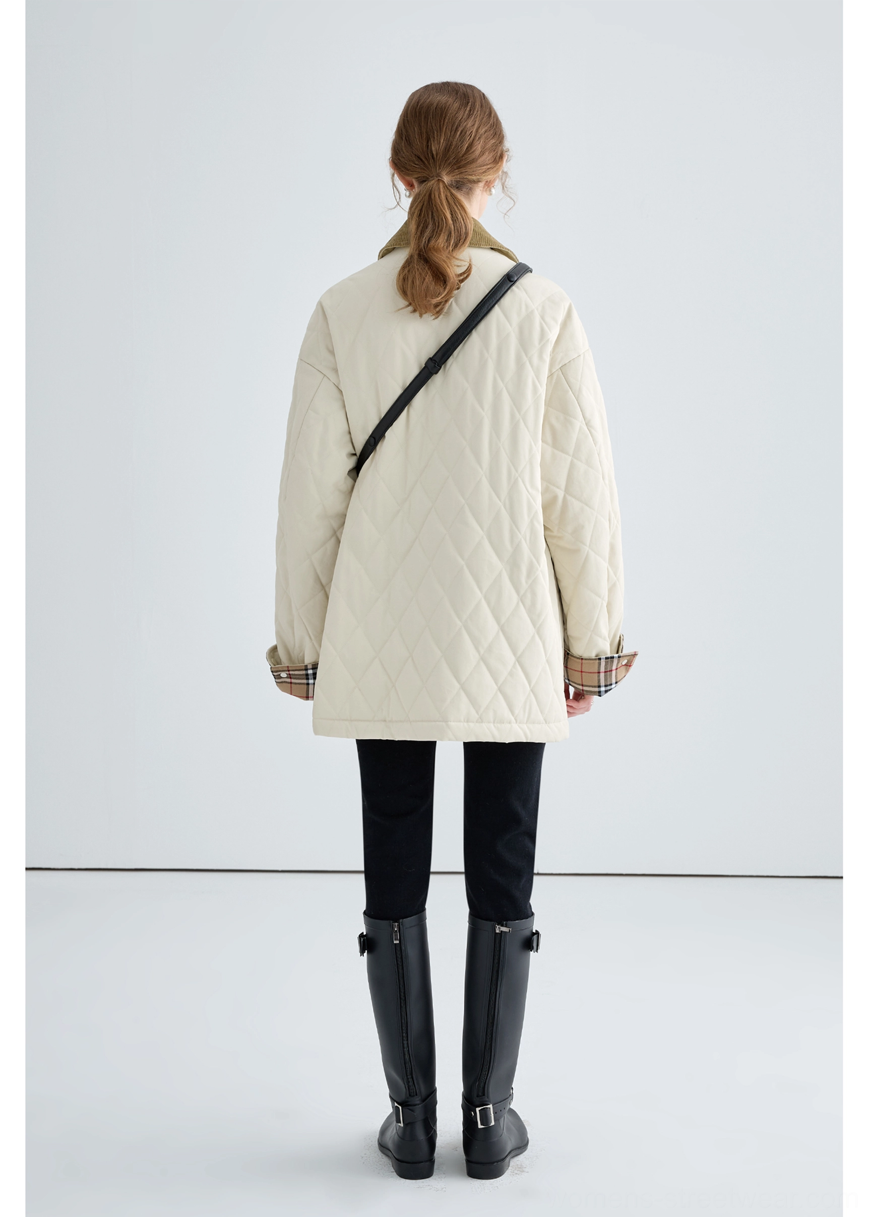 Plaid turn-up cuff detail on women's beige quilted cotton jacket with contrast brown corduroy trim
