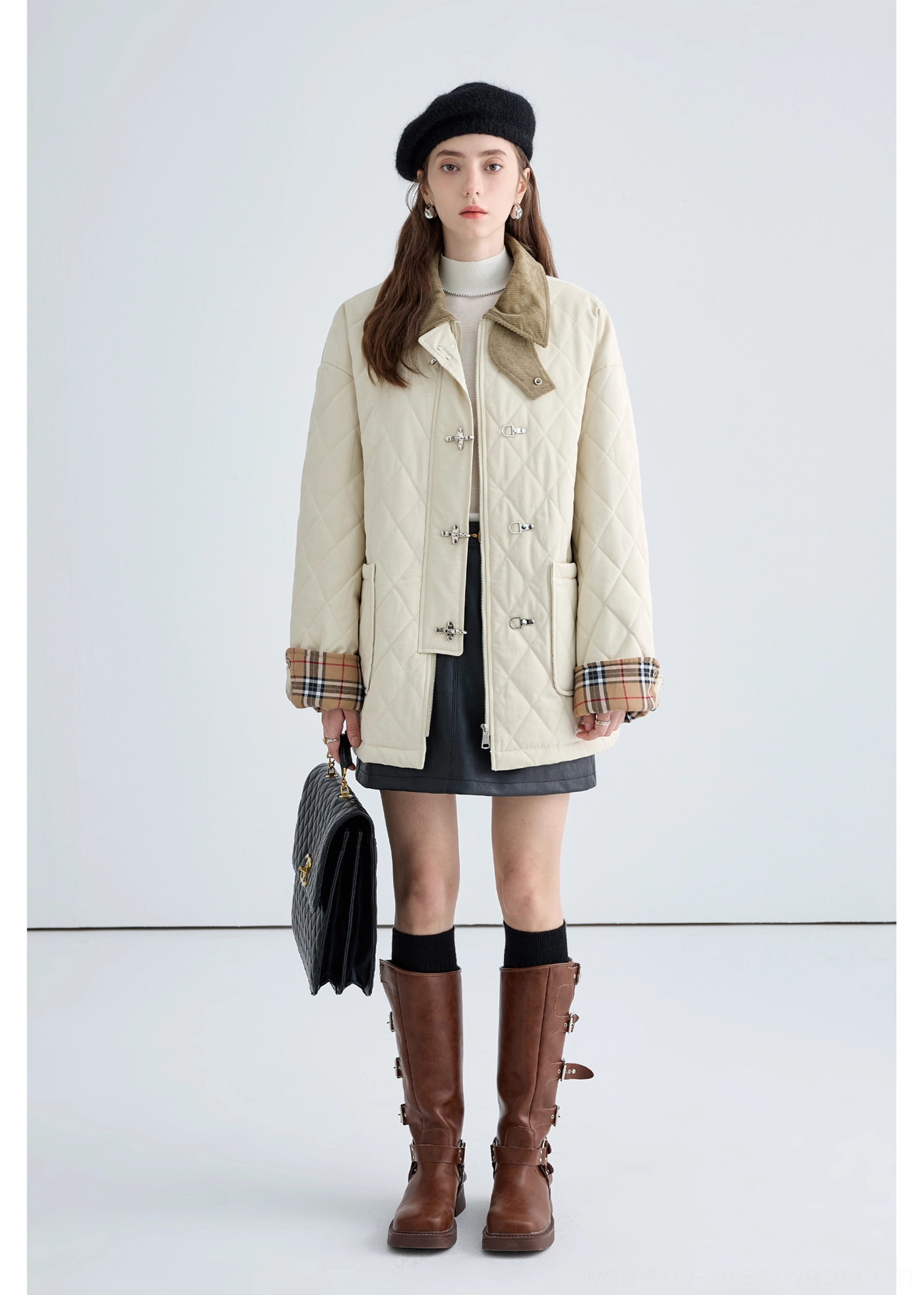 Women's beige quilted cotton jacket with metal buckles styled with beret, mini skirt and brown riding boots