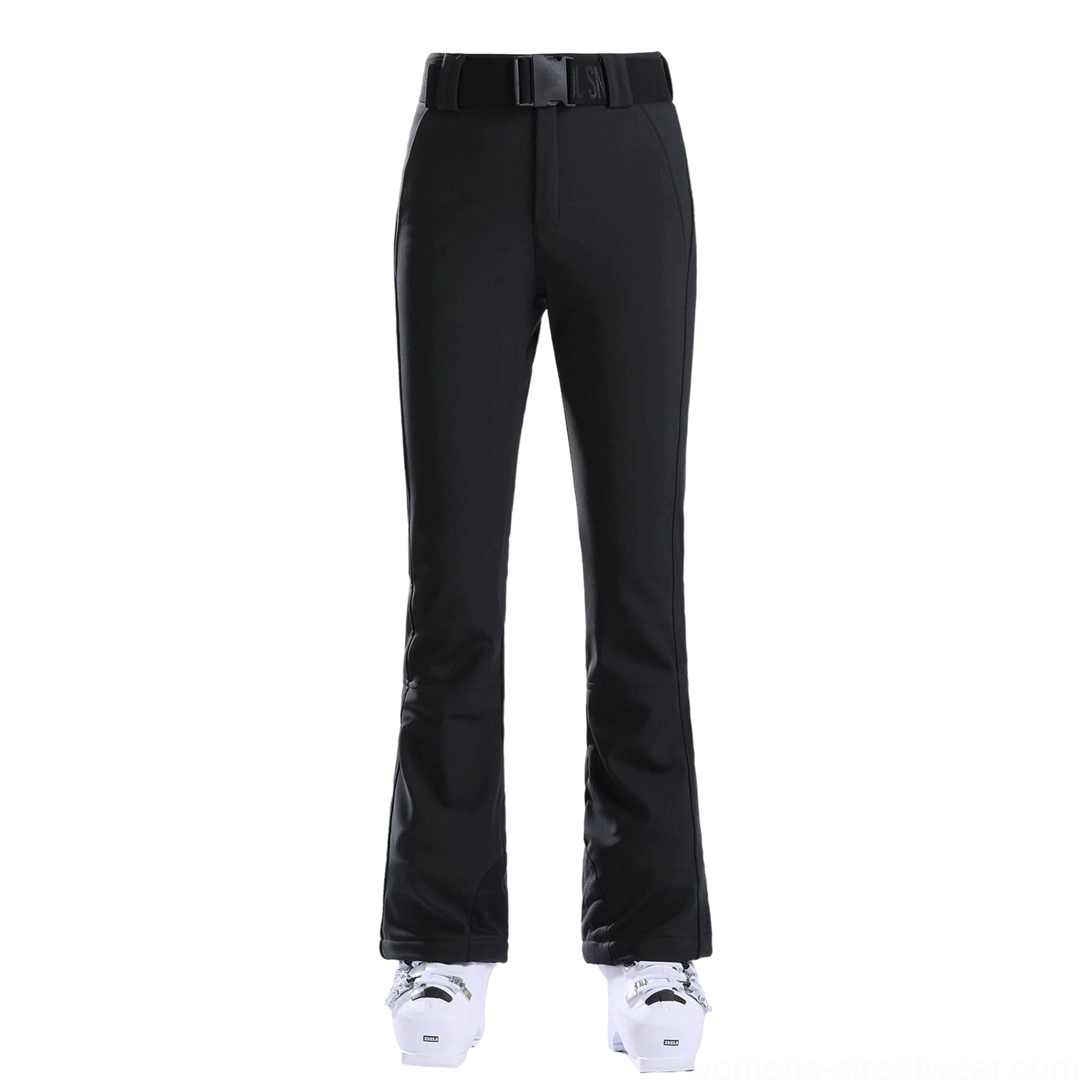 Black women's belted flared ski pants flat lay with white ski boots and contrast cuff protection