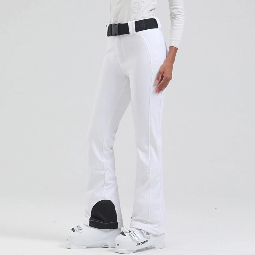 Women's white waterproof flared ski pants with adjustable black belt and reinforced cuff panels