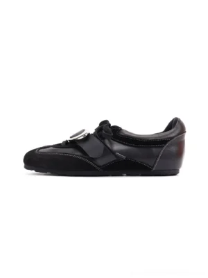 Black genuine leather German trainer sneakers with metallic vamp panel and low-top streetwear silhouette