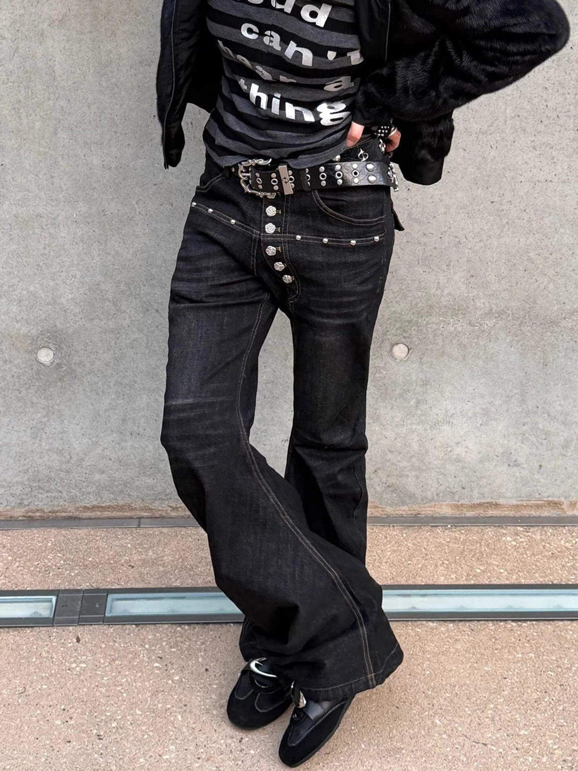 Women's black leather German trainer sneakers with metallic panel and streamlined low-top streetwear design