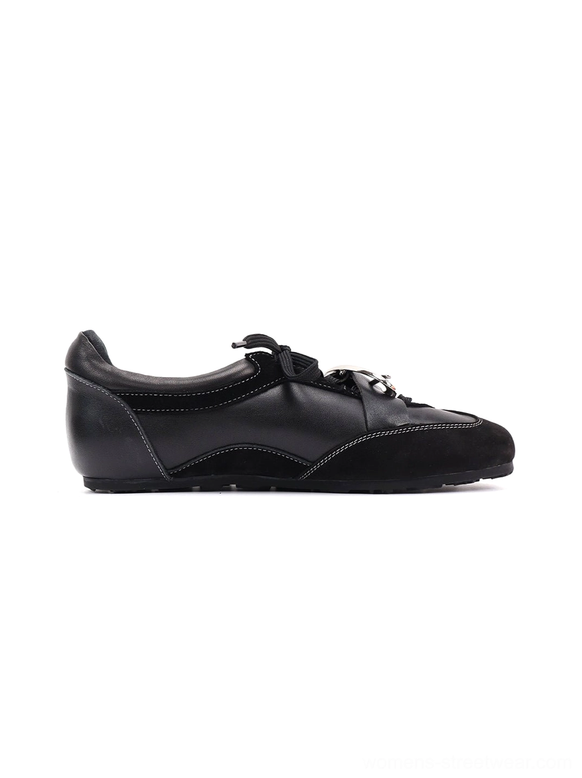 Black leather German trainer sneakers with metallic panel, folded tongue, and versatile urban streetwear appeal