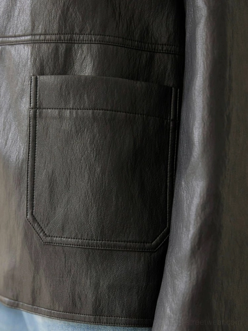 Women’s black leather jacket suitable for layering over tops, knitwear, jeans, and dresses