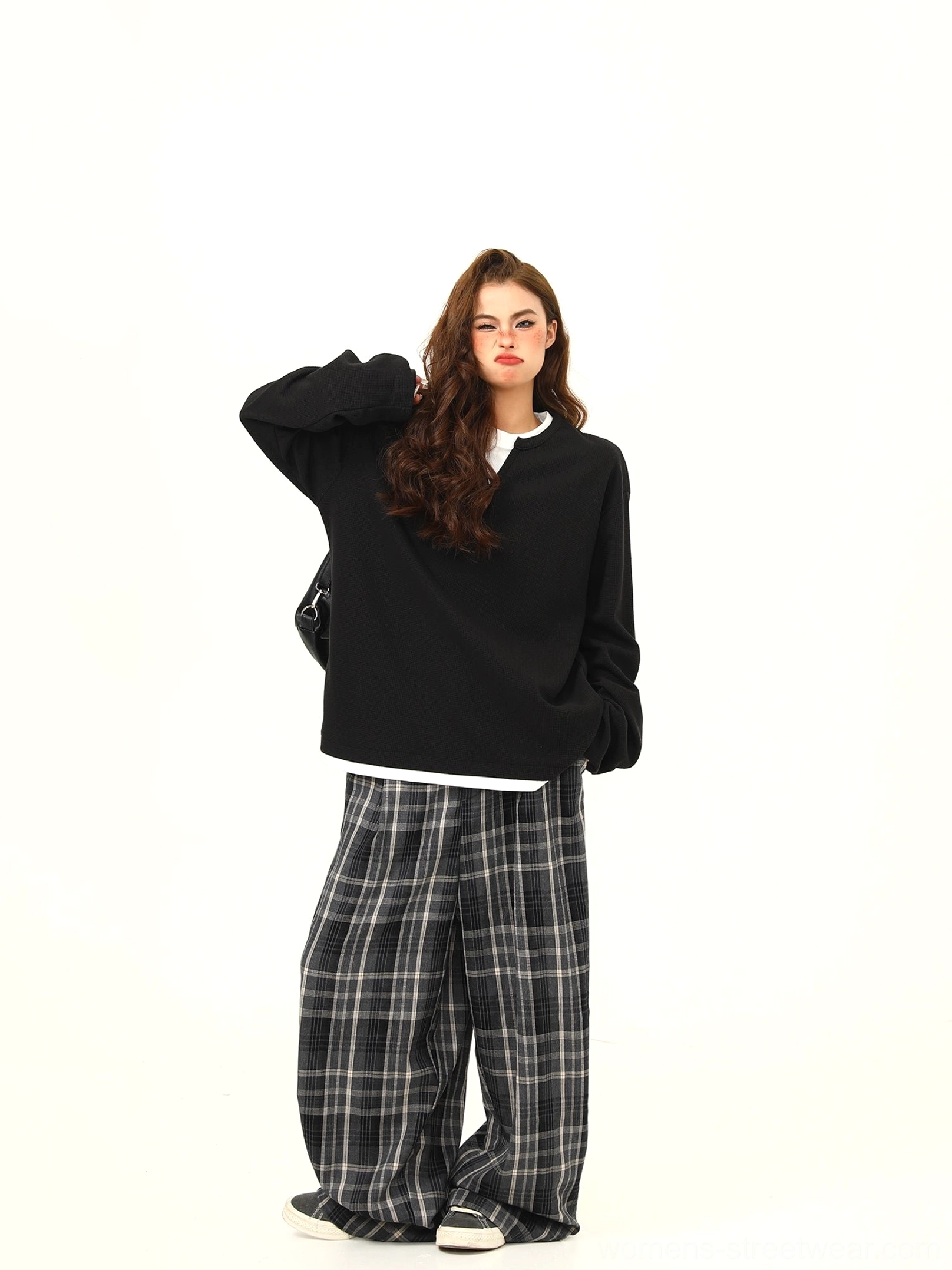Black waffle textured oversized Henley pullover with contrast white hem and loose long sleeve streetwear silhouette