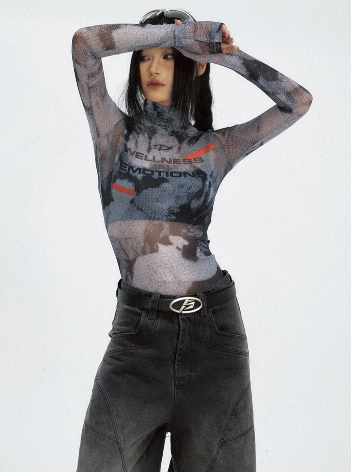 Women's black sheer mesh turtleneck streetwear top with cropped slim fit, graphic print, long sleeves, and wide-leg black jeans